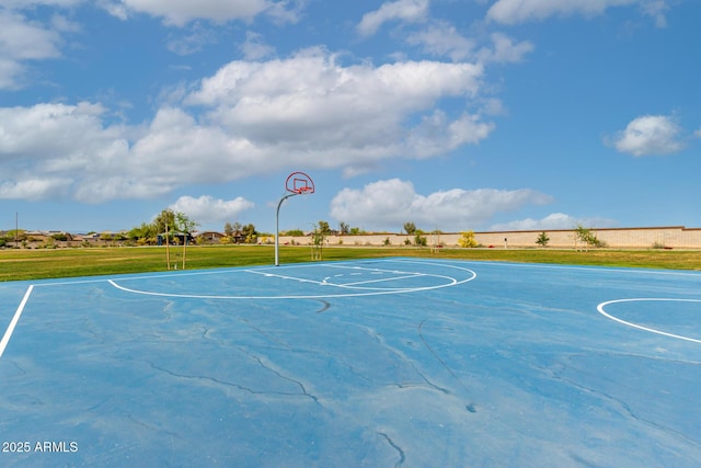view of sport court featuring a lawn and community basketball court