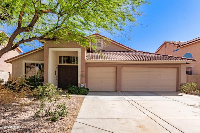 1631 E Carla Vista Dr, Chandler, AZ 85225 - view of front of home featuring a tiled roof, driveway, stucco siding, and an attached garage