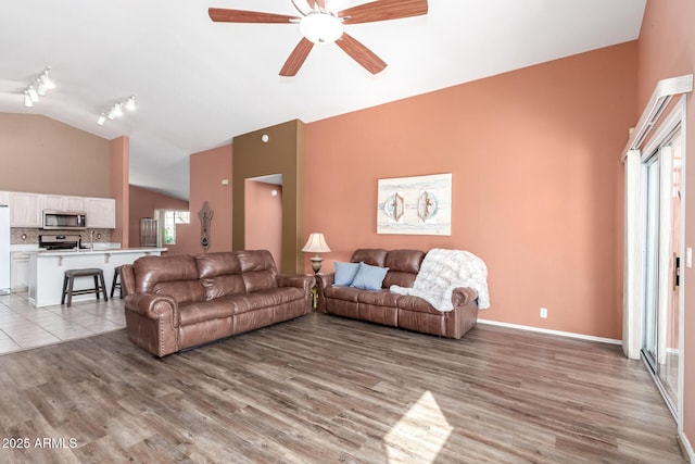 1631 E Carla Vista Dr, Chandler, AZ 85225 - living room featuring high vaulted ceiling, track lighting, a ceiling fan, light wood finished floors, and baseboards