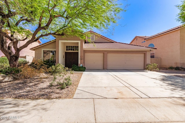 1631 E Carla Vista Dr, Chandler, AZ 85225 - view of front of property featuring an attached garage, driveway, stucco siding, and a tile roof