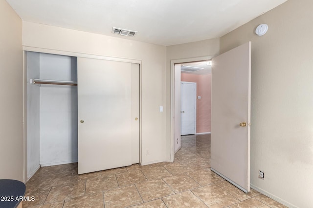 1631 E Carla Vista Dr, Chandler, AZ 85225 - unfurnished bedroom featuring visible vents, baseboards, and a closet
