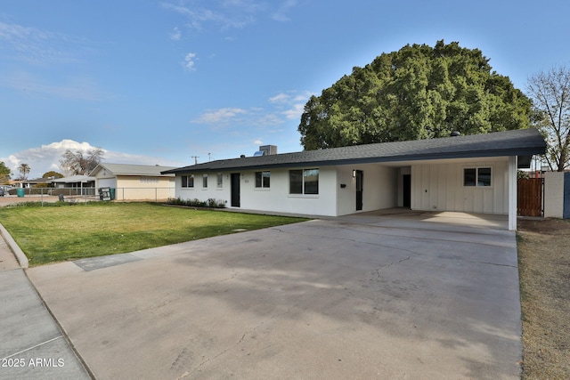 ranch-style home with a carport and a front yard