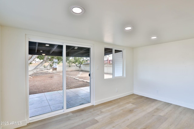 unfurnished room featuring light hardwood / wood-style flooring