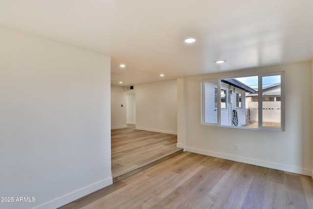 spare room featuring light hardwood / wood-style flooring