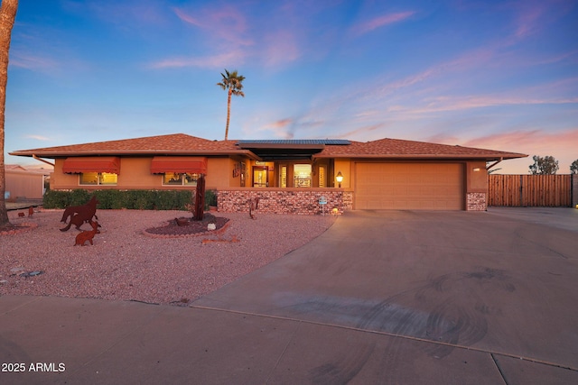 prairie-style home featuring a garage