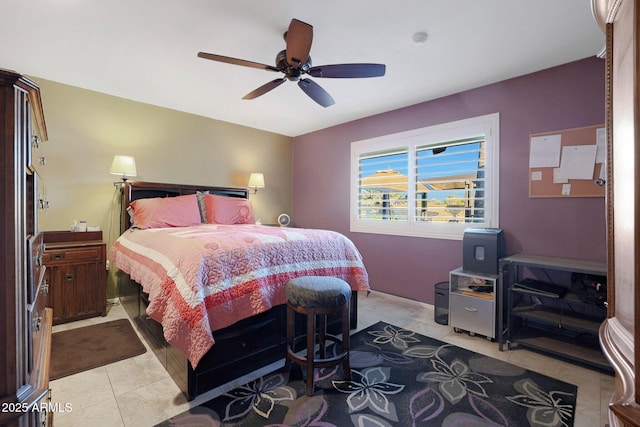 tiled bedroom featuring ceiling fan