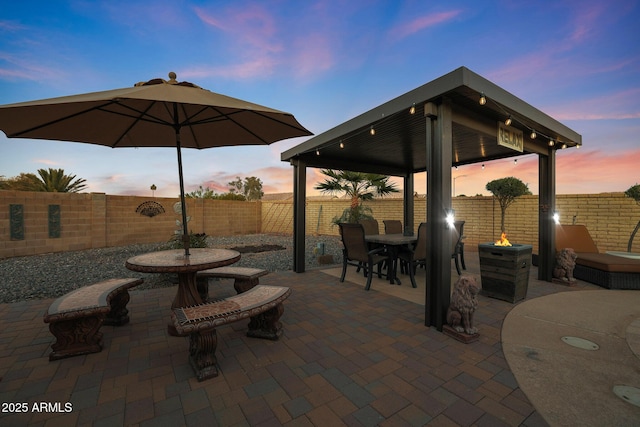 view of patio terrace at dusk