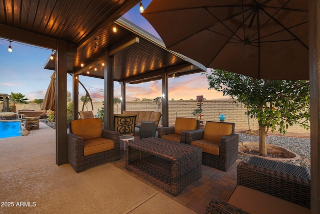 patio terrace at dusk with outdoor lounge area