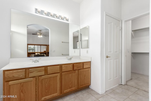 bathroom featuring ceiling fan, tile patterned flooring, and vanity