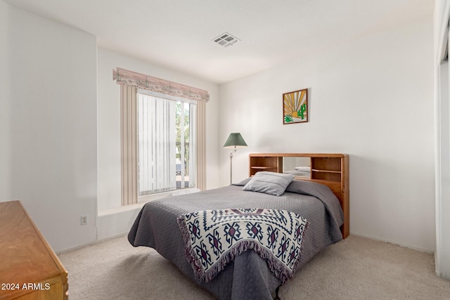 bedroom with light carpet