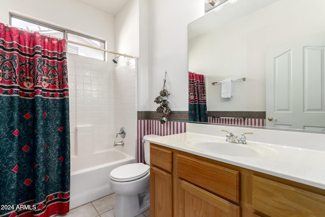 full bathroom with tile patterned flooring, vanity, shower / tub combo, and toilet