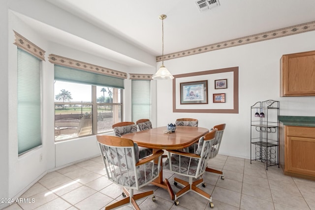 dining area featuring light tile patterned floors