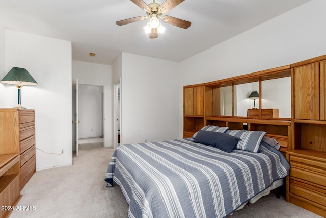 bedroom featuring ceiling fan and light colored carpet