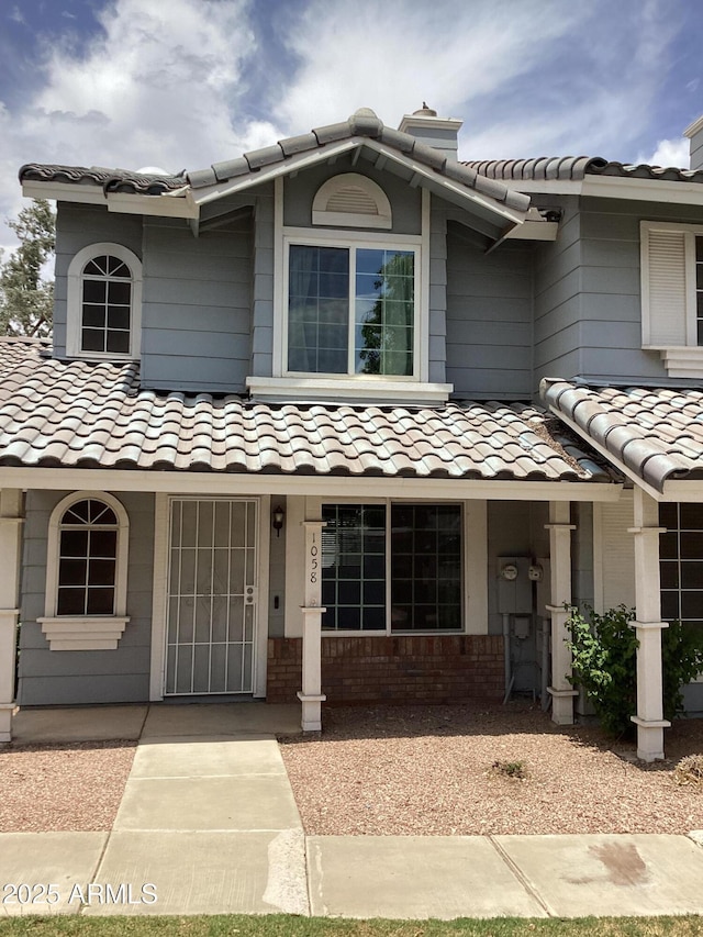 view of front of home featuring a tiled roof