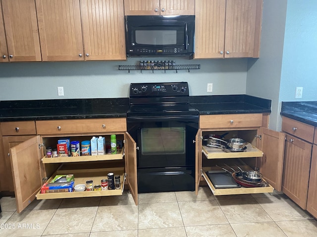 kitchen featuring black appliances and light tile patterned floors