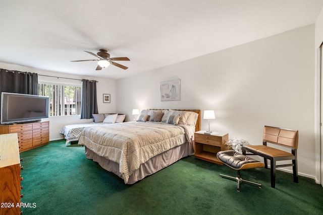 bedroom with dark colored carpet and ceiling fan