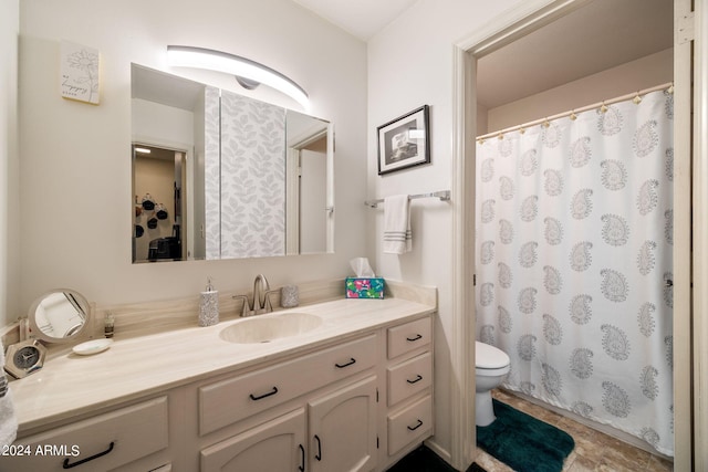 bathroom with vanity, toilet, and a shower with curtain