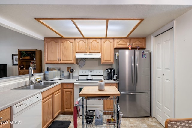 kitchen featuring white appliances and sink