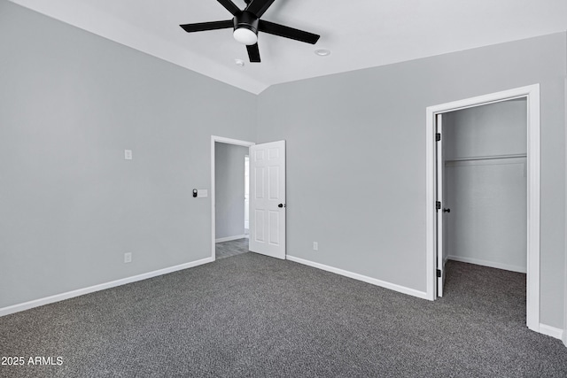 1804 E Pueblo Ave, Phoenix, AZ 85040 - unfurnished bedroom featuring dark colored carpet, lofted ceiling, baseboards, a walk in closet, and a ceiling fan