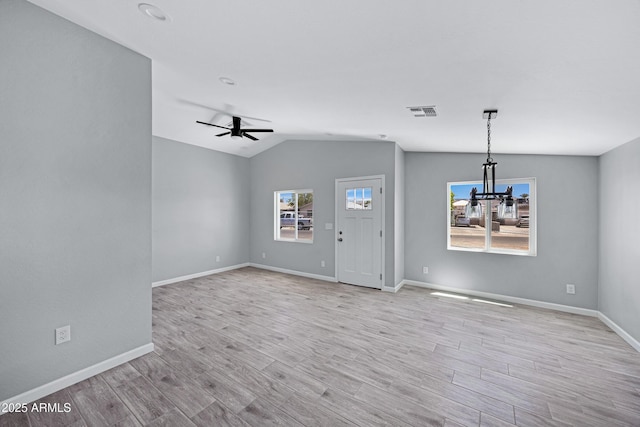 1804 E Pueblo Ave, Phoenix, AZ 85040 - foyer featuring a chandelier, wood finished floors, lofted ceiling, baseboards, and a ceiling fan