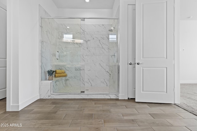 bathroom with a shower with shower door