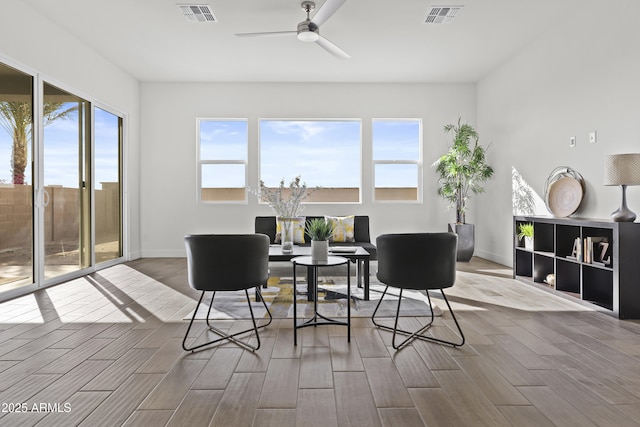 interior space with ceiling fan