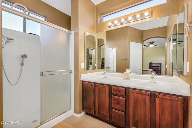 bathroom with a stall shower, a ceiling fan, connected bathroom, tile patterned flooring, and double vanity