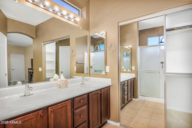 full bathroom with double vanity and tile patterned flooring