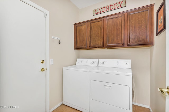 laundry room with washing machine and dryer, cabinet space, and baseboards