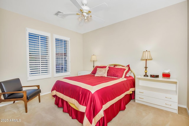 bedroom featuring light carpet, baseboards, and ceiling fan