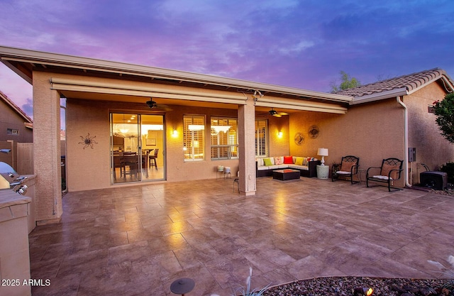 view of patio / terrace with a ceiling fan and an outdoor living space