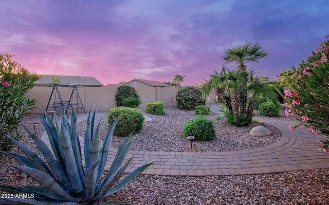 fenced backyard with a patio area