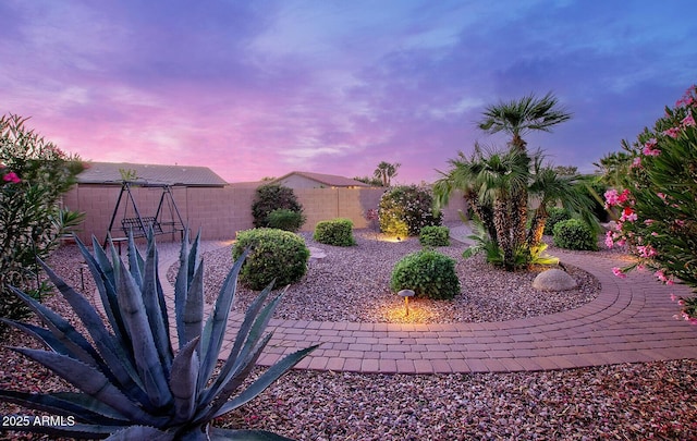 fenced backyard with a patio