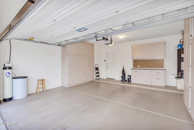 garage with a garage door opener and gas water heater