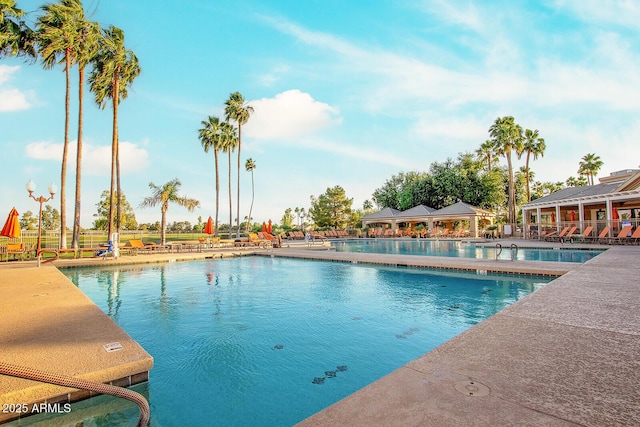community pool with a patio area