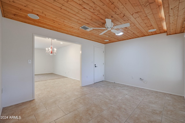 empty room with ceiling fan with notable chandelier, wood ceiling, and light tile patterned floors