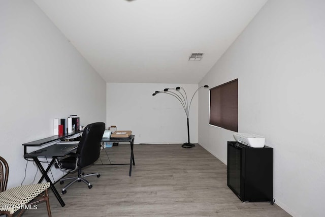 office featuring visible vents and light wood-style flooring