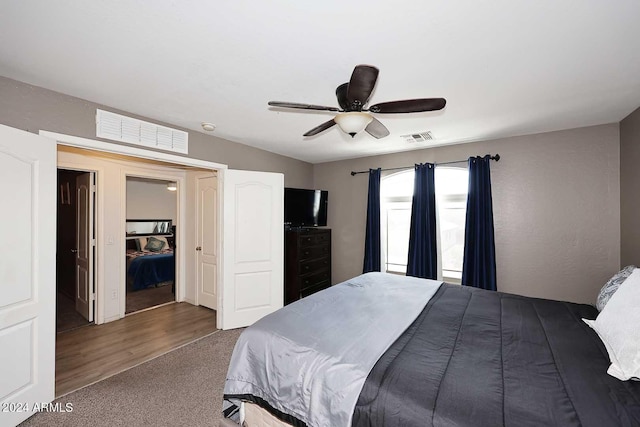 bedroom featuring visible vents, carpet, and ceiling fan