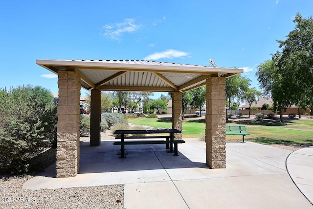 view of community with a gazebo, a yard, and a patio area