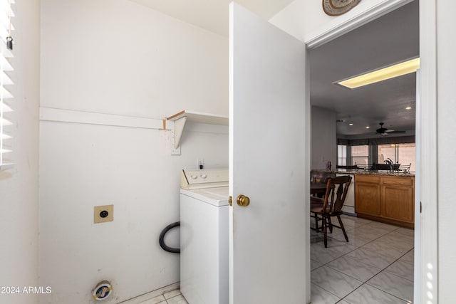 laundry area featuring washer / dryer, light tile patterned floors, laundry area, ceiling fan, and a sink