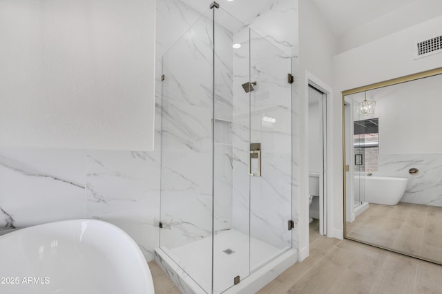 3926 E Coconino St, Phoenix, AZ 85044 - full bath featuring tile walls, a soaking tub, and a marble finish shower