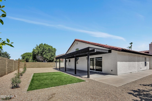 3926 E Coconino St, Phoenix, AZ 85044 - rear view of house featuring a fenced backyard, stucco siding, a patio, and a tile roof