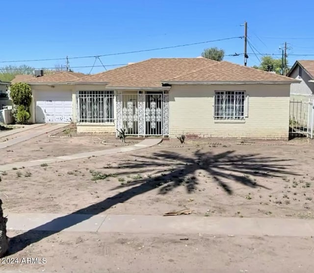 single story home with a garage