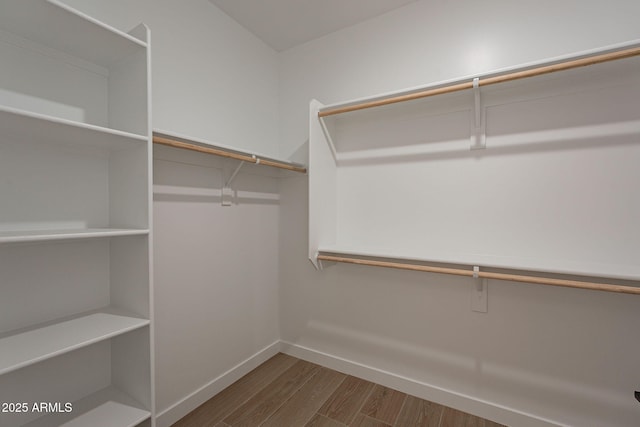 spacious closet with wood finished floors