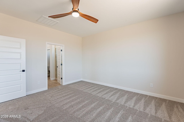 unfurnished bedroom featuring a ceiling fan, baseboards, visible vents, and carpet flooring