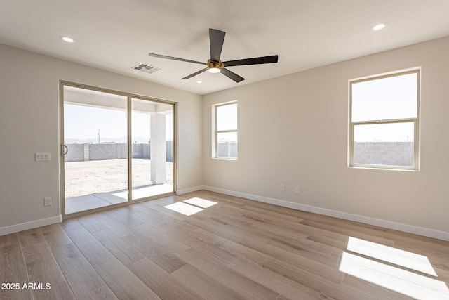 unfurnished room with recessed lighting, visible vents, light wood-style flooring, ceiling fan, and baseboards