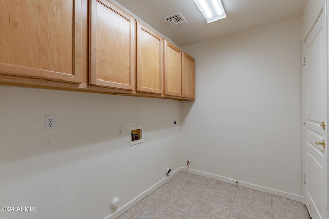 laundry area with washer hookup, hookup for an electric dryer, cabinets, and hookup for a gas dryer