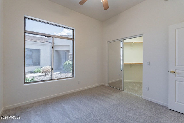 2223 E Branham Ln, Phoenix, AZ 85042 - unfurnished bedroom featuring baseboards, carpet floors, ceiling fan, and multiple windows