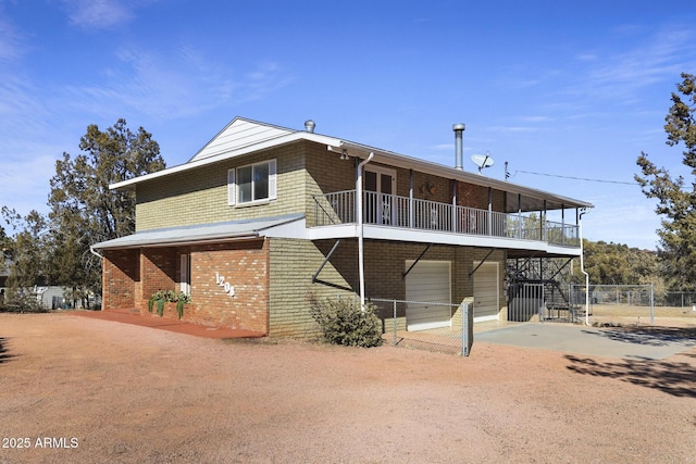 back of property with a garage