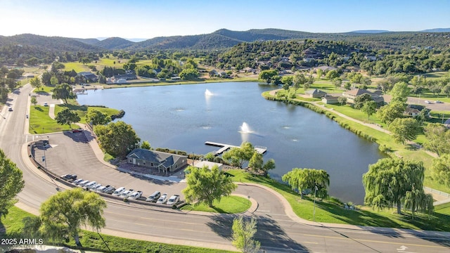 drone / aerial view with a water and mountain view